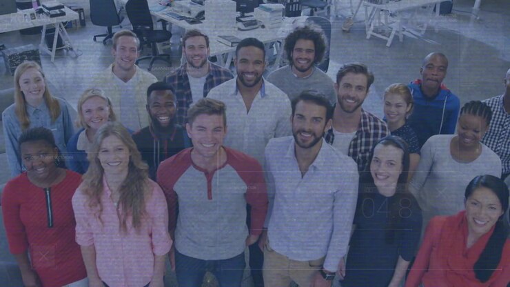 Diverse Group of Professionals Smiling in Modern Office
