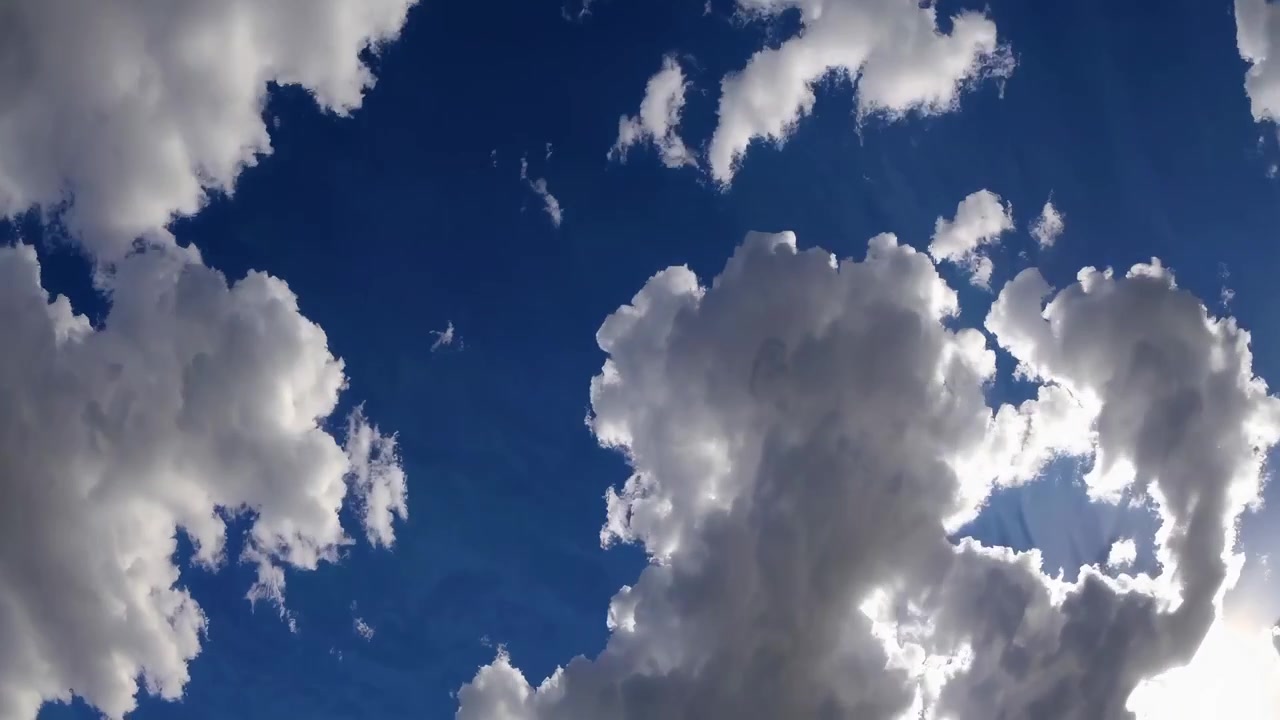 Time Lapse of White Clouds Moving Across a Deep Blue Sky