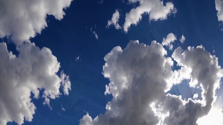 Time Lapse of White Clouds Moving Across a Deep Blue Sky