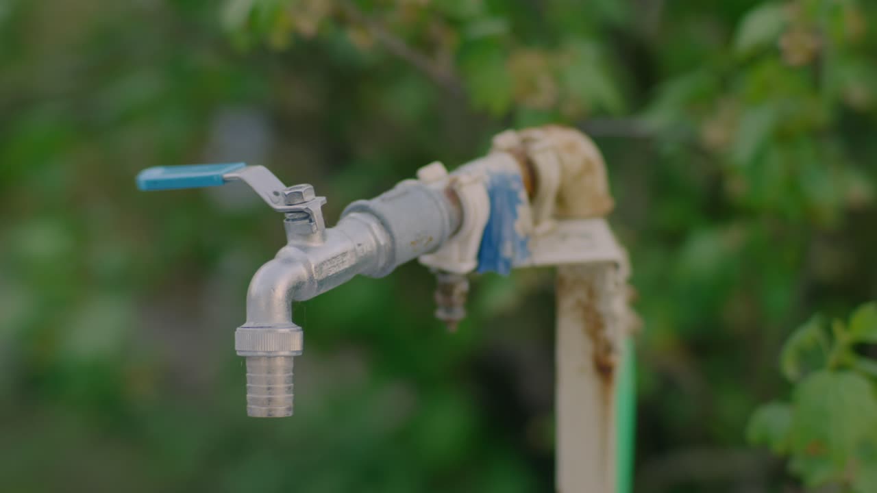 Close-up of an Old Rusty Garden Tap