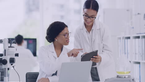 team of laboratory scientists using digital tablet