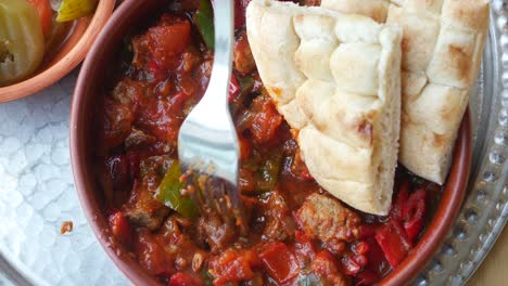 delicious meat and vegetable dish with pita bread