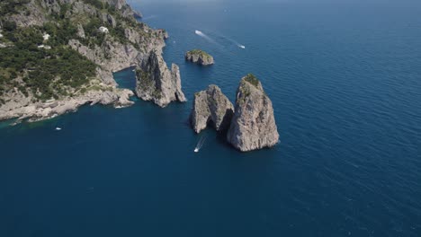 iconic sea stacks on rugged capri coast, bay of naples