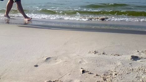 Couple-People-Walking-Barefoot-On-Sandy-Beach-Slowmotion-Shot