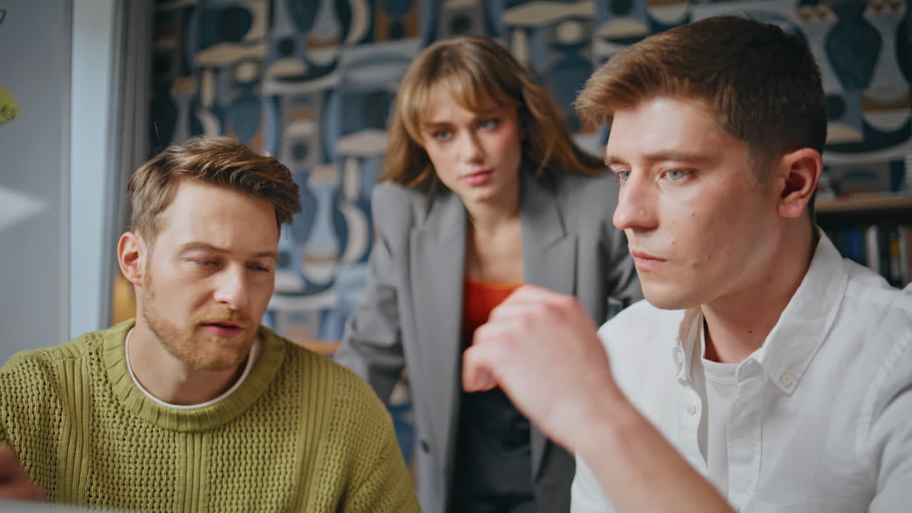 Young businesspeople working office agency closeup. Manager assisting designers