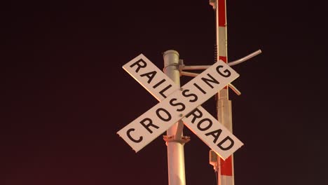 railroad crossing sign on tracks