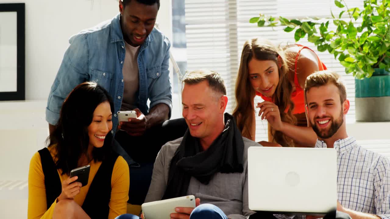 Business colleagues sitting together on a couch