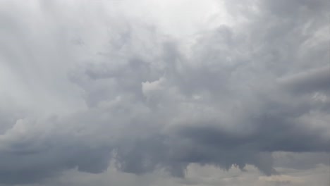 Mid-afternoon-thunderstorm-rain-clouds-forming-and-blending-across-the-african-horizon-time-lapse,-noise-free-4k-footage