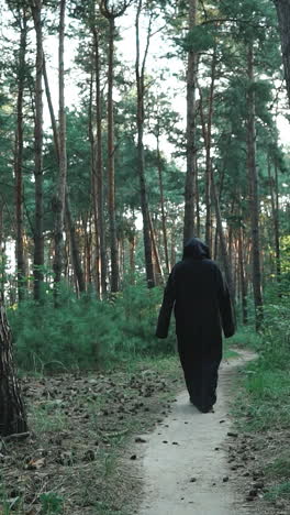 ghost in the woods. horror scene of a scary ghost. mysticism of halloween vertical video