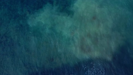 Overhead-Shot-Of-Small-Waves-Splashing-Softly-On-Rocks,-Tenerife,-Spain