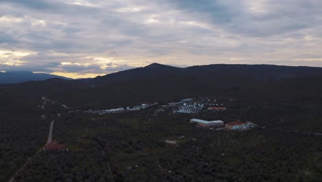 lush mountains in lesvos island with moria refugee camp in greece.refugees makeshift settlement. -aerial drone