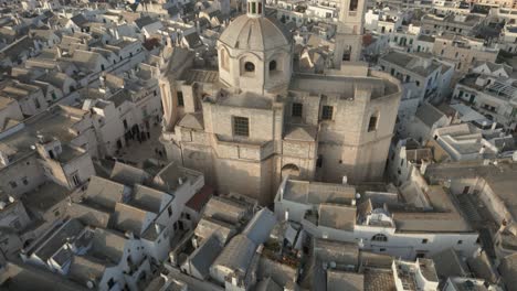 Drone-camera-revealing-medieval-temple-San-Giorgio-Martire-in-the-city-of-Locorotondo