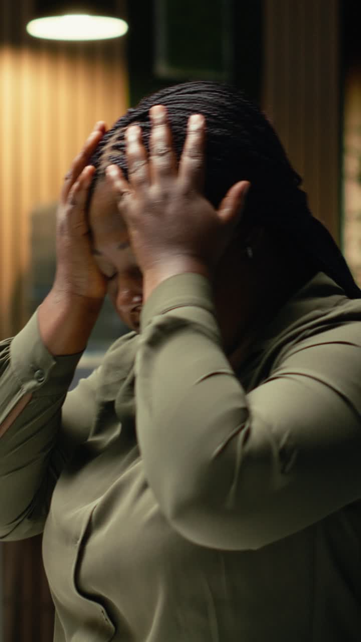 Vertical Video Female worker correcting pose and stretching her neck muscles