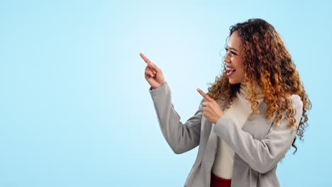 Pointing,-excited-and-business-woman-in-studio