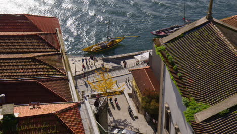 porto riverfront town seen from the pedestrian walkway of dom luís i bridge in portugal. high angle shot
