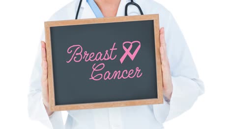 Animation-of-pink-ribbon-logo-with-breast-cancer-text-on-black-board-over-doctor