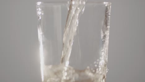 delicious alcoholic apple cider being poured into clean glass