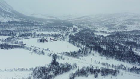 aerial drone view of dramatic wintery landscape above the arctic circle in norway