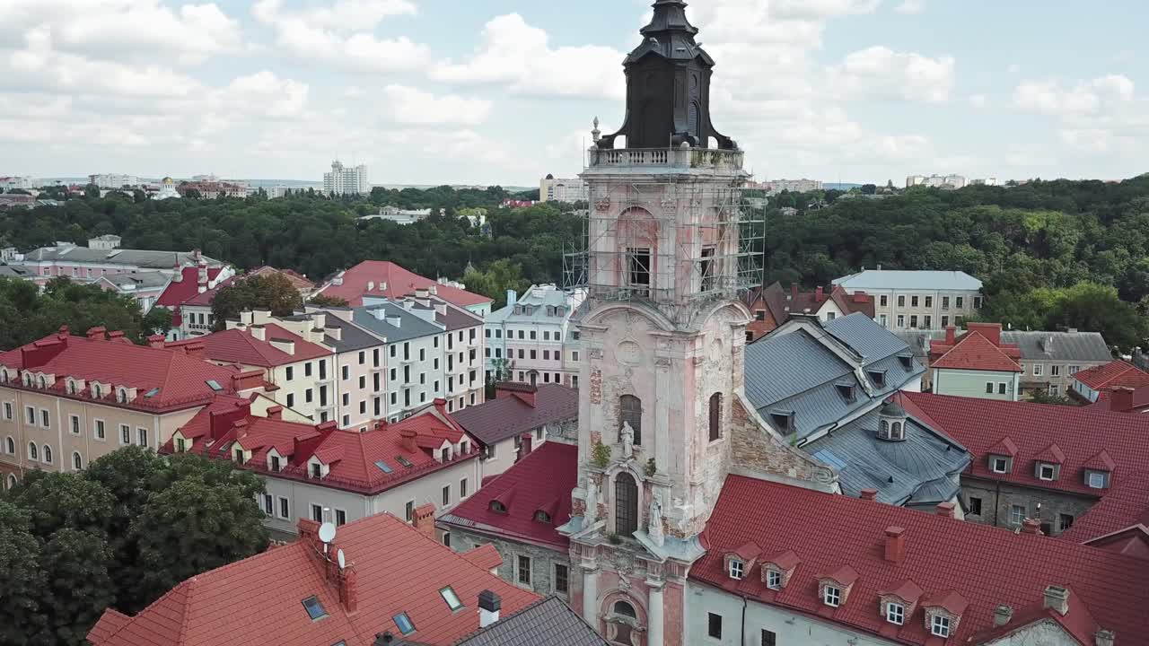Aerial View of Dominican Monastery at Kamyanets Podilsky,Ukraine on a sunny day with white clouds.Pan left,medium shot.