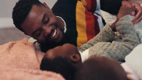Black-family,-playing-and-a-father-on-the-bed