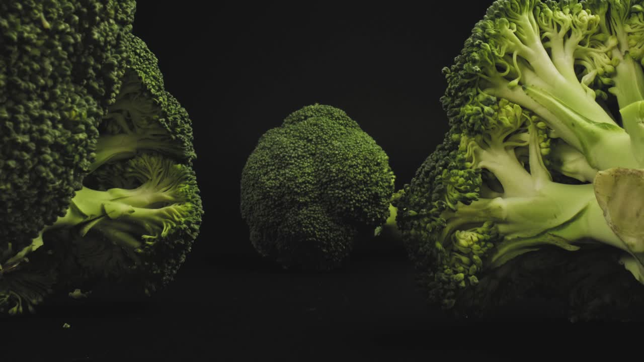 Several broccoli heads and stalks