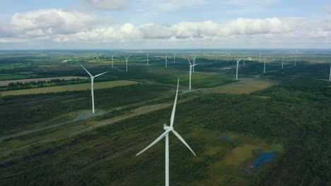 descending a wind turbine, aerial view, 4k, wind farm in bog land