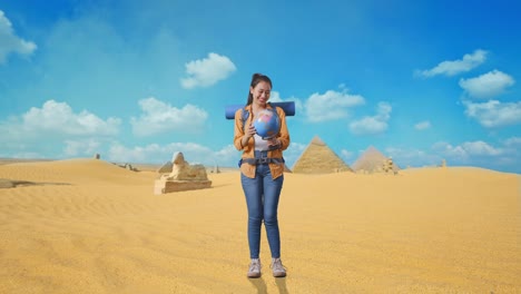 Woman Exploring the Egyptian Desert with a Globe