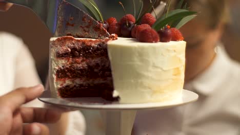 red velvet cake sliced at a party