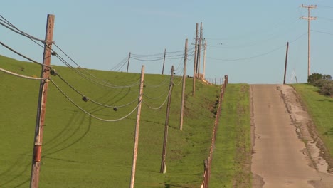 A-country-road-moves-along-beside-green-fields-1