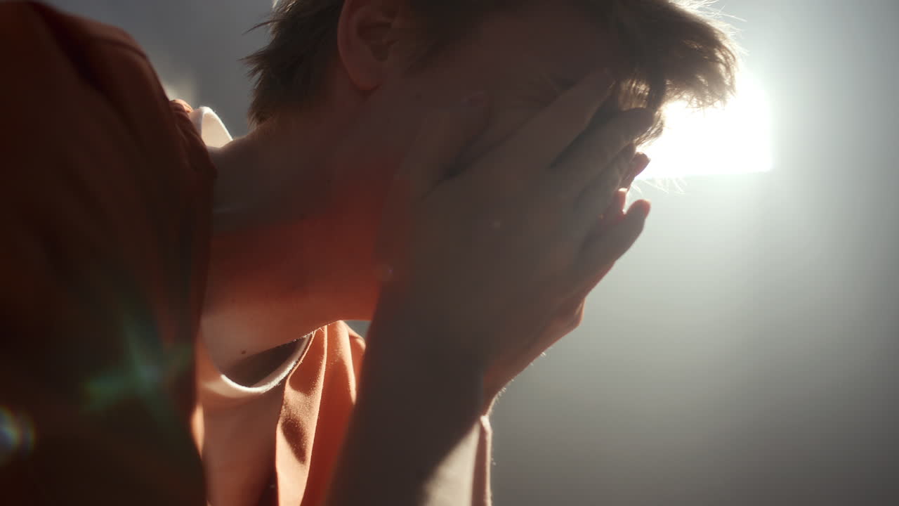 Regretful Female Prisoner Crying in Emotional Breakdown