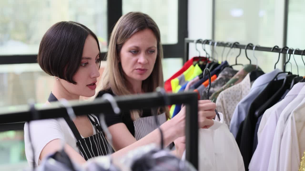 Skilled inspector assesses clothing craftsmanship and style