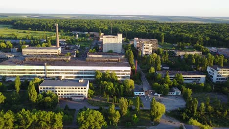 abandoned old buildings. aerial view of the ruins of an old abandoned factory near farmland