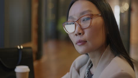 focused woman in a coffee shop