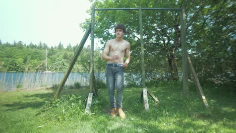 A-young-man-dancing-at-outdoor-gym-expressing-happiness