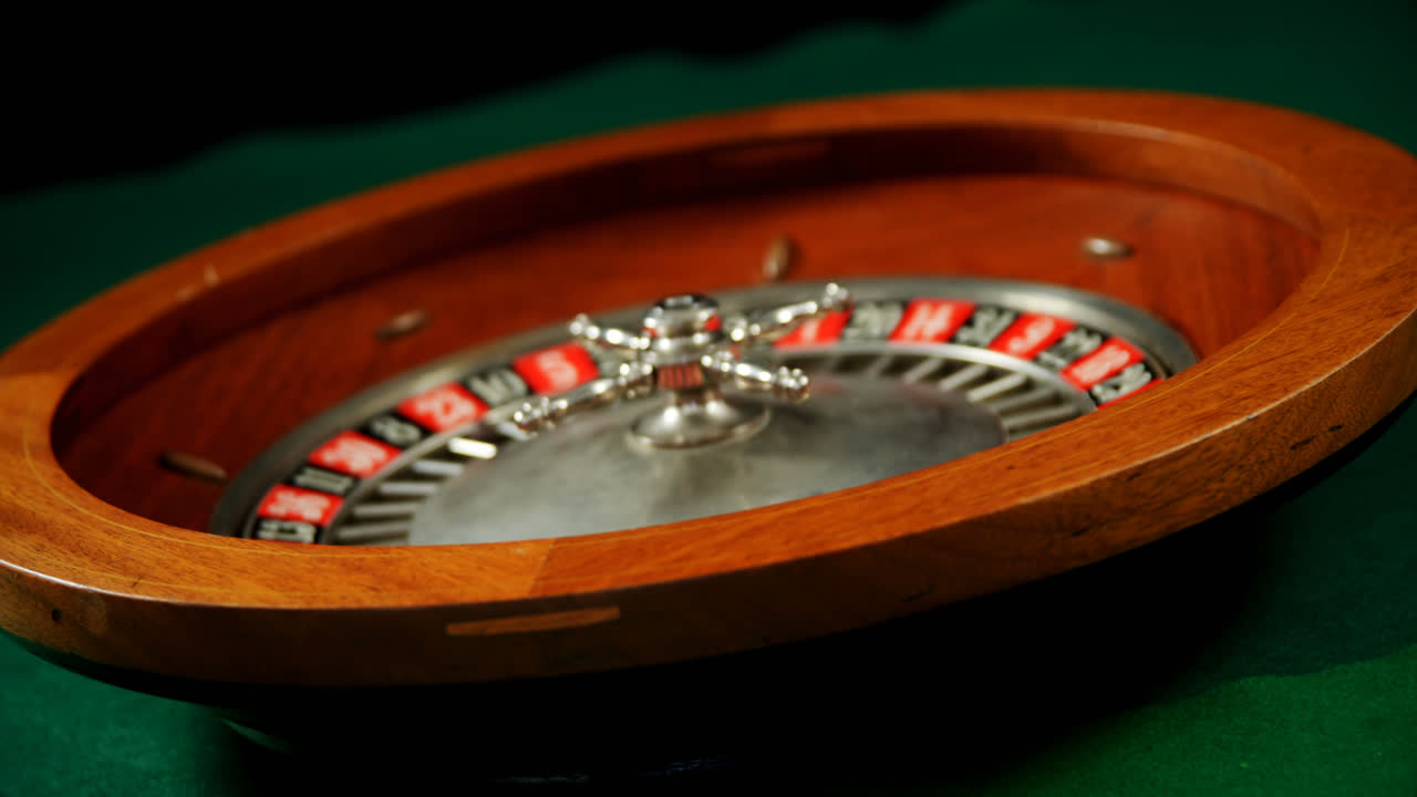 Close-up of spinning roulette wheel on poker table 4k