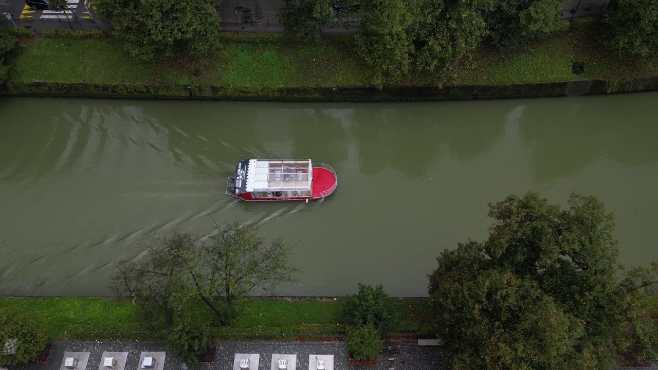 aerial top down boat cruising the Ljubljanica river in Slovenian capital Ljubljana