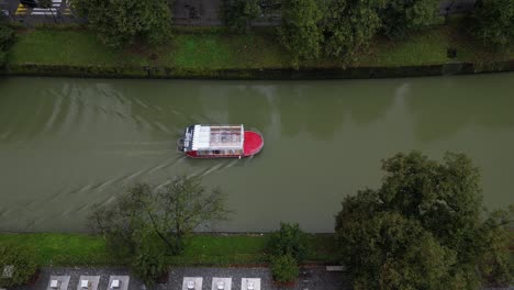 aerial top down boat cruising the ljubljanica river in slovenian capital ljubljana