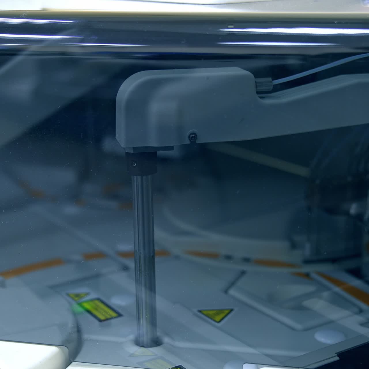 Moving details inside the technological machine. Advanced equipment in modern laboratory for medical tests. Close up