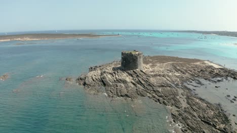 Ancient-tower-of-La-Pelosa-beach-near-Sardinia-island,-Italy