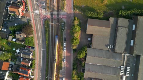 birds eye view of a train crossing a street