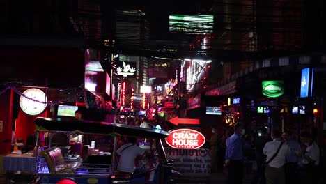 vibrant city street with neon lights and people