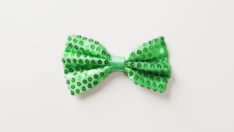 Video of st patrick&#039;s green bow tie with copy space on white background