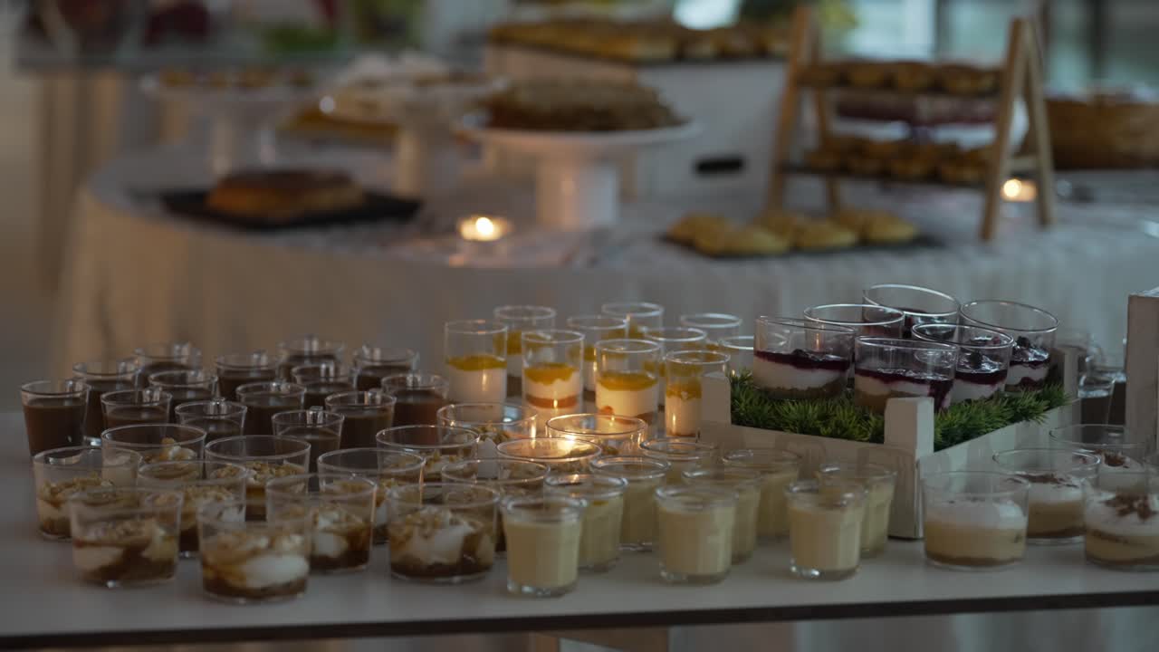 variety of layered desserts displayed on a decorated table