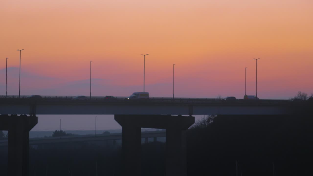Timelapse of M4 Motorway at Sunset as Commuters Drive Home After Work and Lorry Drivers Transport Goods to Their Destination. Travel Car Footage. ProRes 4K.