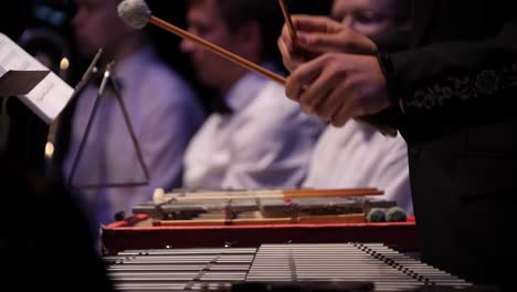 percussionist playing vibraphone in orchestra performance