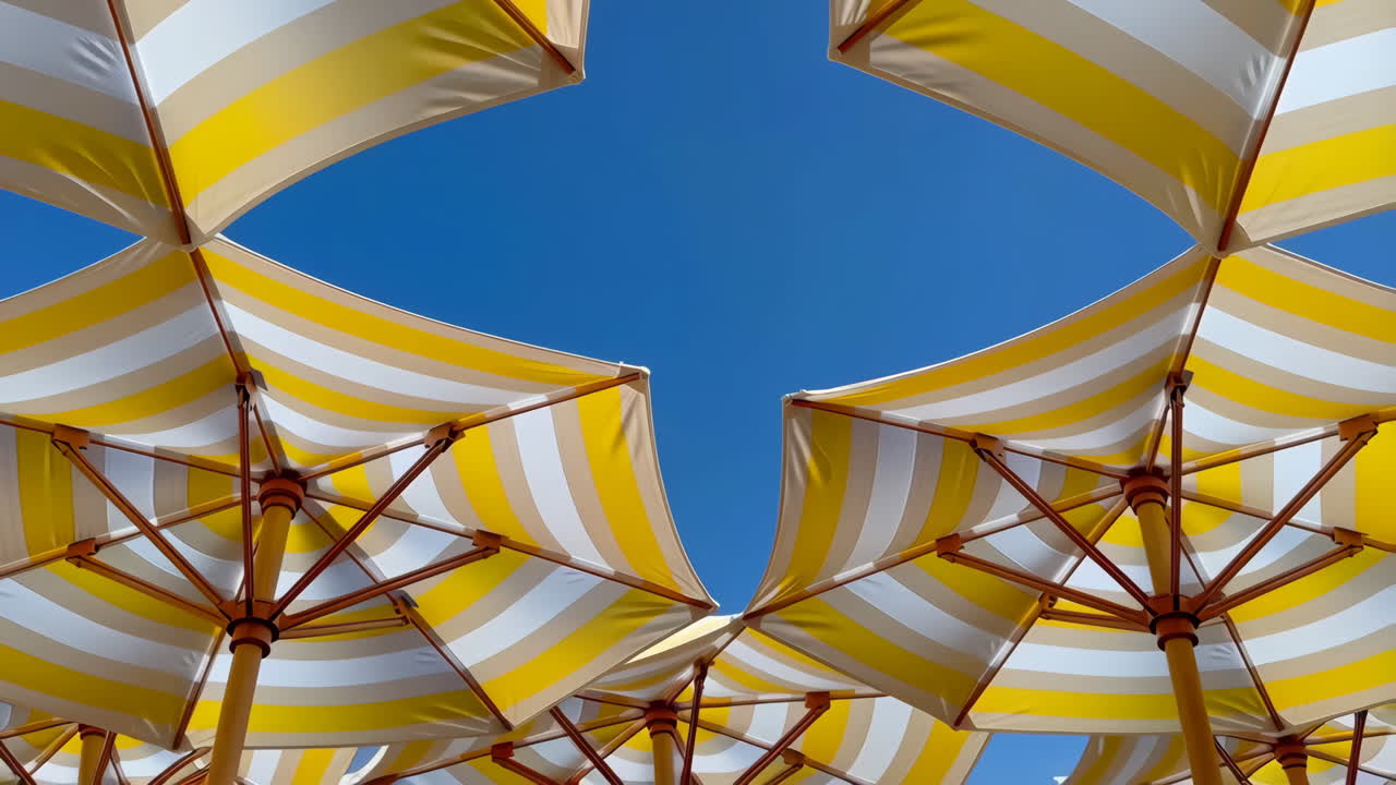 Beach umbrellas against a clear blue sky