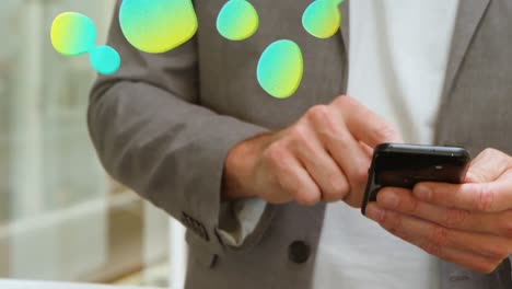 animation of stains over caucasian businessman using smartphone