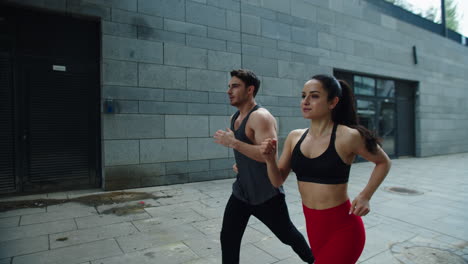 young man and woman training run outdoor