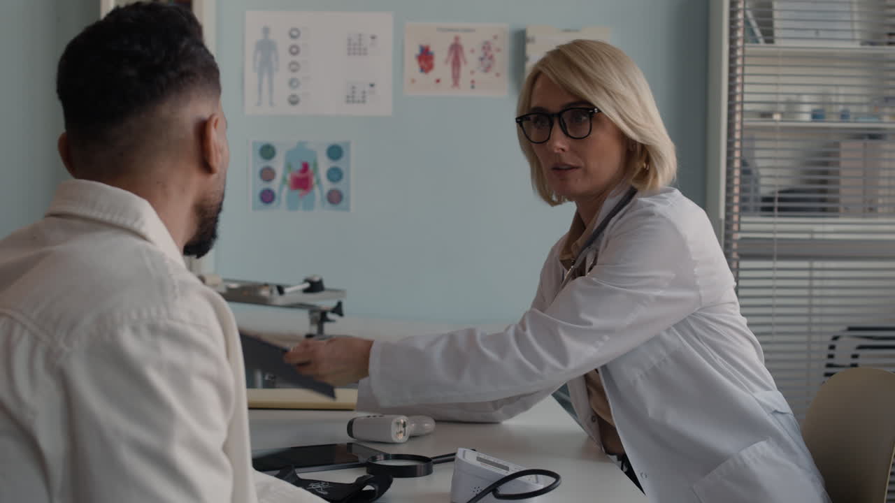 Doctor consulting with patient in medical office