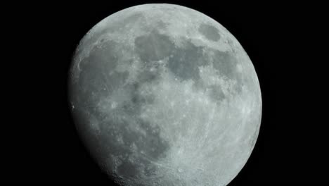 a close-up of the moon with its craters, moving in real time